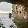 Kayaking near towering cliffs