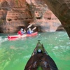 Kayakers exploring Apostle Islands sea caves